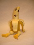banane assis avec jambes mobiles