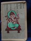 carnet avec la couverture en parchemin peint avec ganesh - bouddha ou laksmi